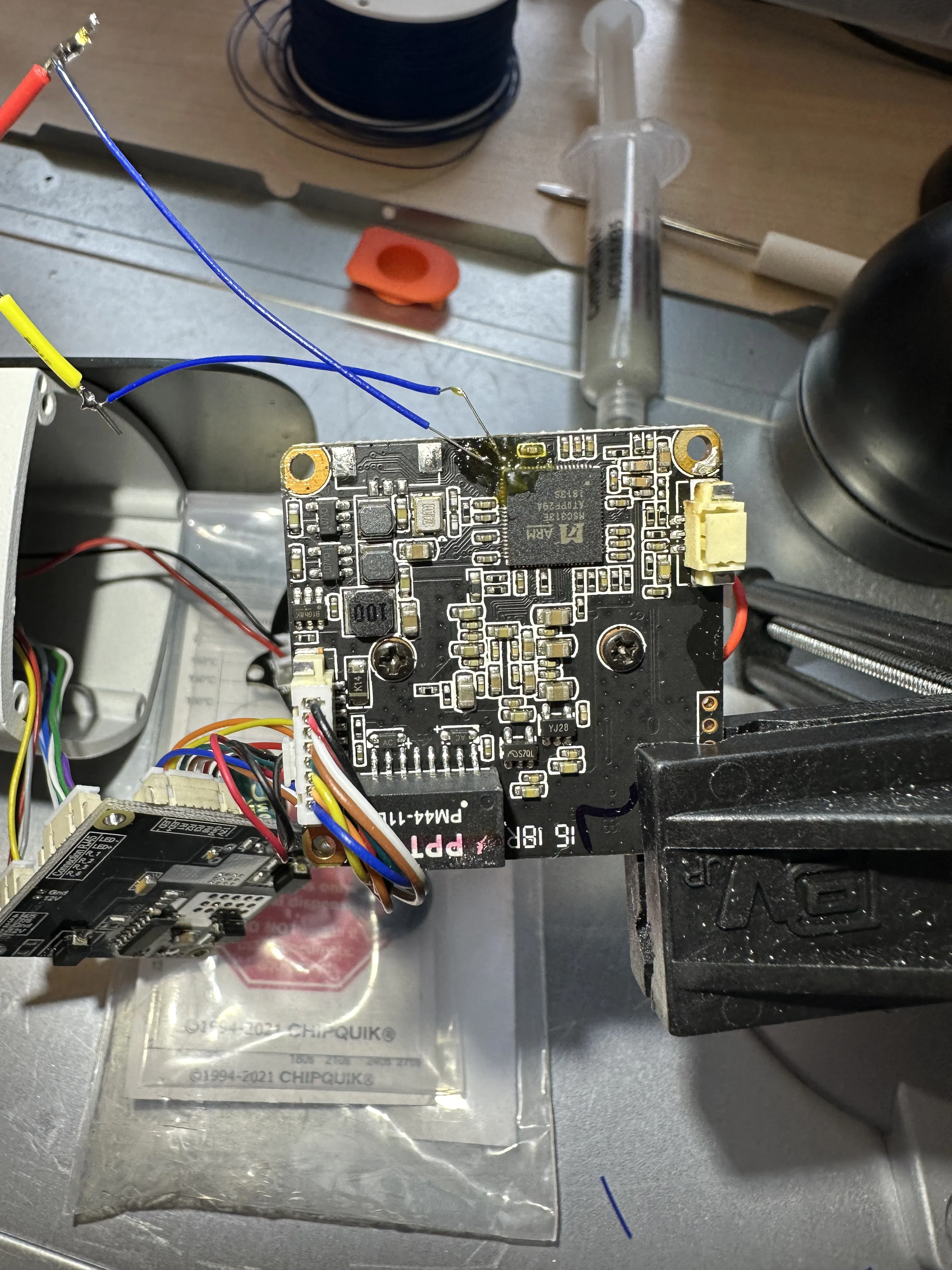 Two small wires have been soldered to the pads