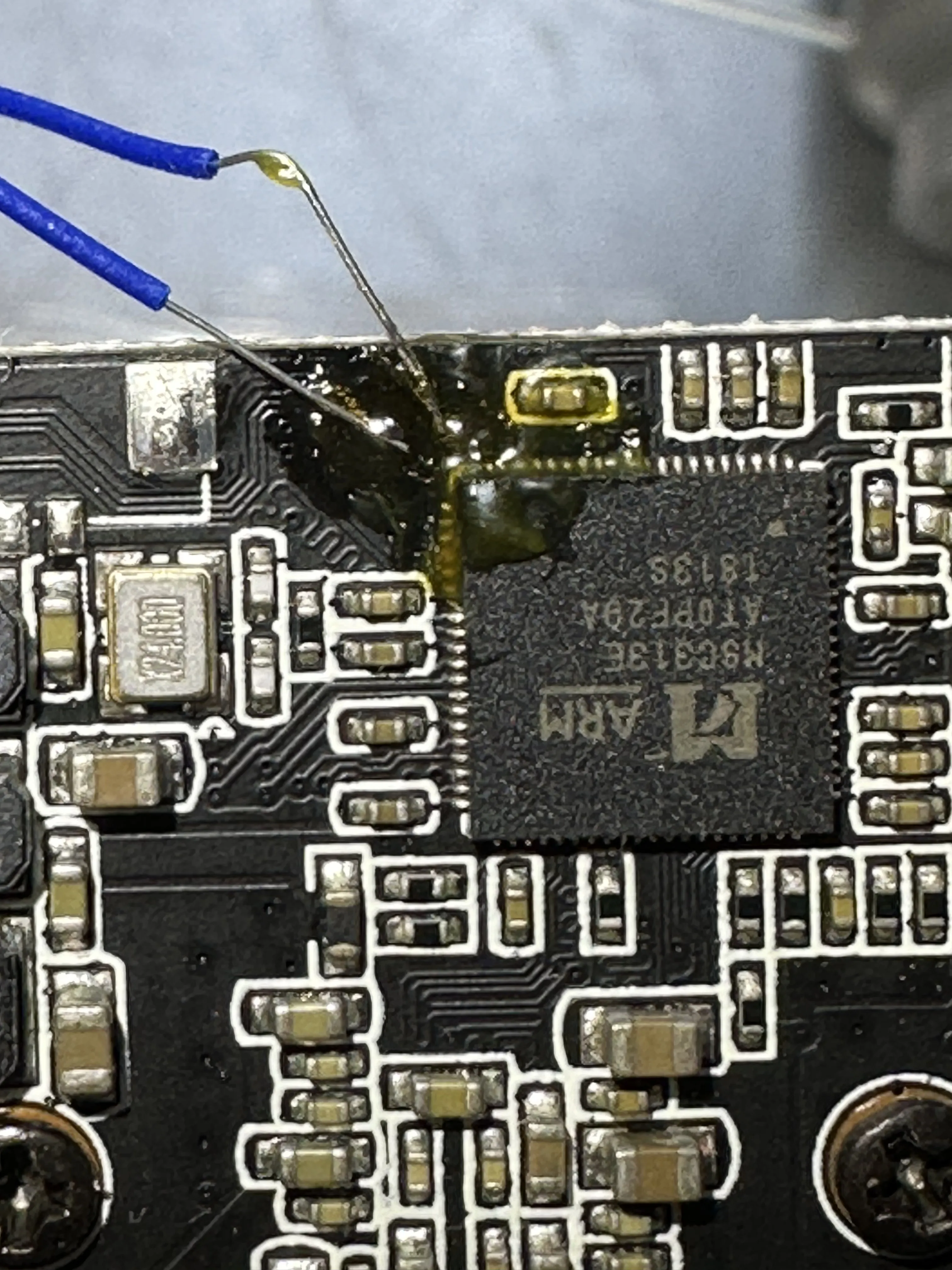 Two small wires have been soldered to the pads, BUT ZOOMED IN!