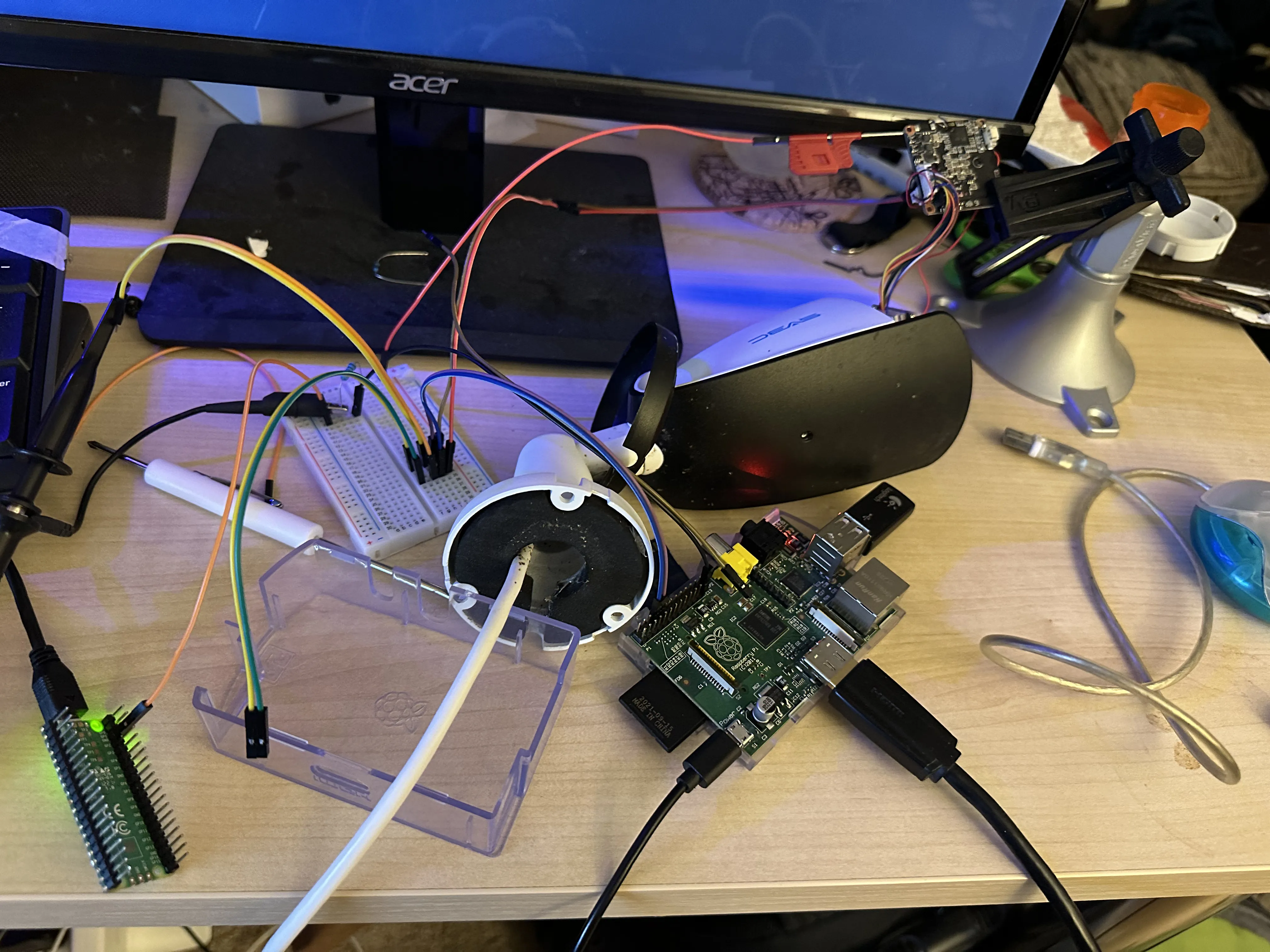 Wires from the IP camera, to a breadboard, to my Raspberry Pi 1st gen and to my Pi Pico.